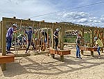 Lower Ropes Course showing some features: (foreground) log traverse, Tarzan swing, lattice boards, (background) upper and lower rope, log hops, virticle netting, and balance logs.